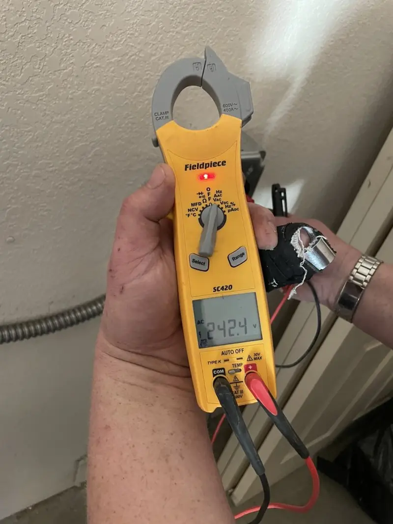 Voltage testing with clamp meter during Electrical Installation Services in Collinsville